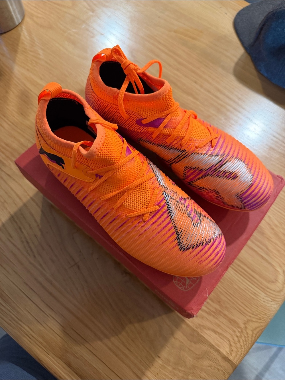 Puma Future 8 Vibrant Orange Soccer Cleats with Silver Swoosh Detail